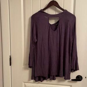 Loose, flowing top with button at the back